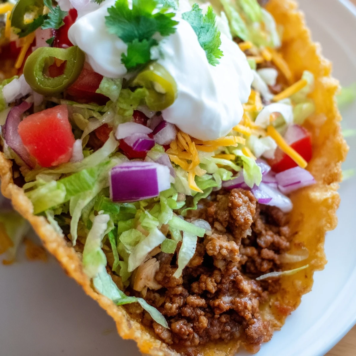 Fully loaded Touchdown Taco Bar with seasoned ground beef, diced chicken, and colorful toppings like shredded lettuce, cheddar, and fresh cilantro.