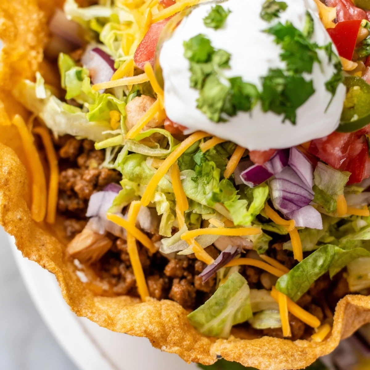 A vibrant spread of the Touchdown Taco Bar featuring warm tortillas, crunchy shells, and bowls of salsa, guacamole, and sour cream.