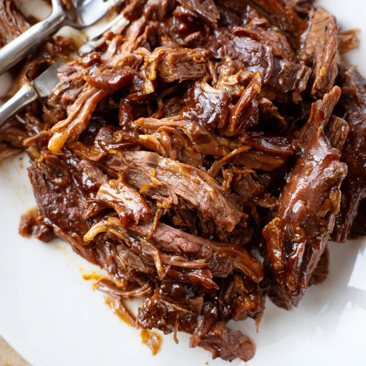 Steamed jasmine rice topped with tender shredded Crock Pot Korean Beef and fresh green onions.