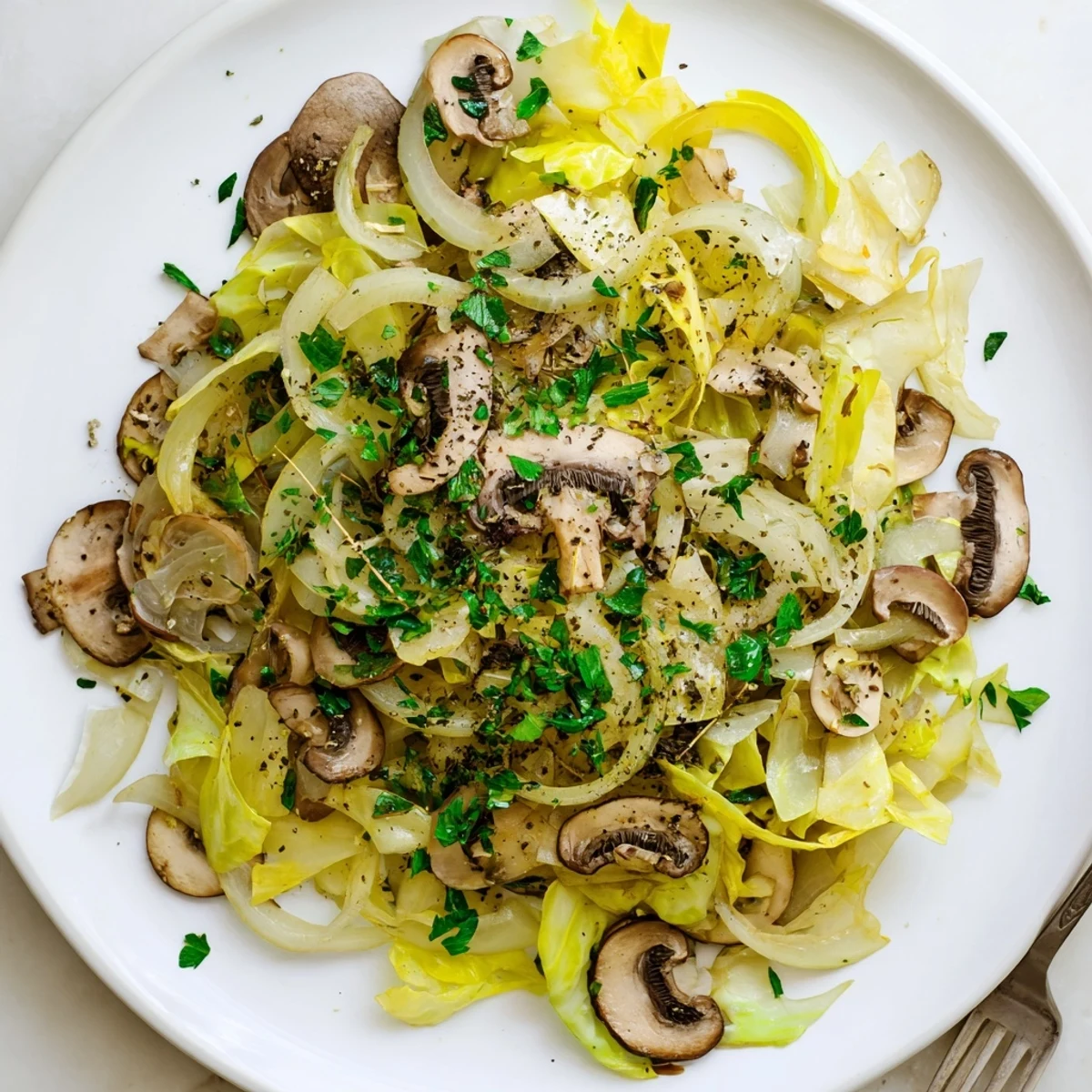 Sautéed Vegetarian Cabbage Mushroom Sauté in a rustic skillet, ready to serve alongside quinoa or a slice of crusty bread.