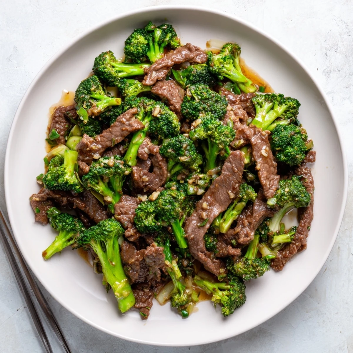Homemade beef and broccoli featuring juicy sliced steak and vibrant broccoli in glossy glaze