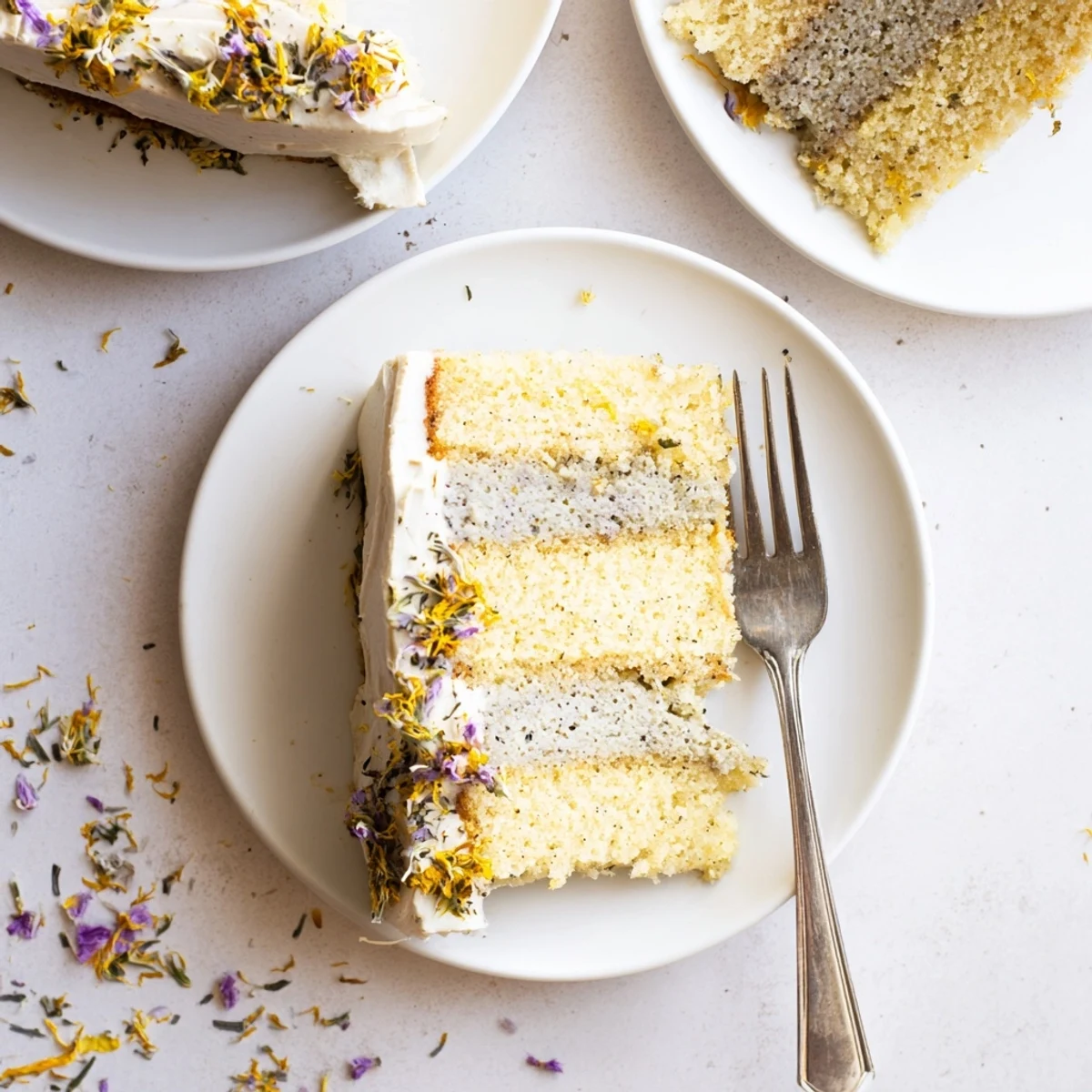 London Fog cake with Earl Grey infused layers and vanilla bean frosting on a rustic wooden board