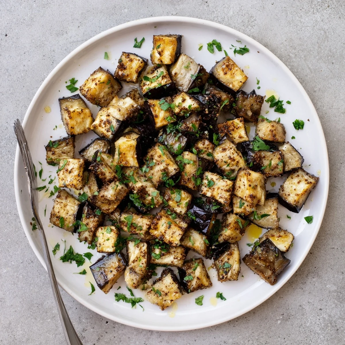 Tender Mediterranean style low calorie air fryer eggplant seasoned with smoked paprika and garlic