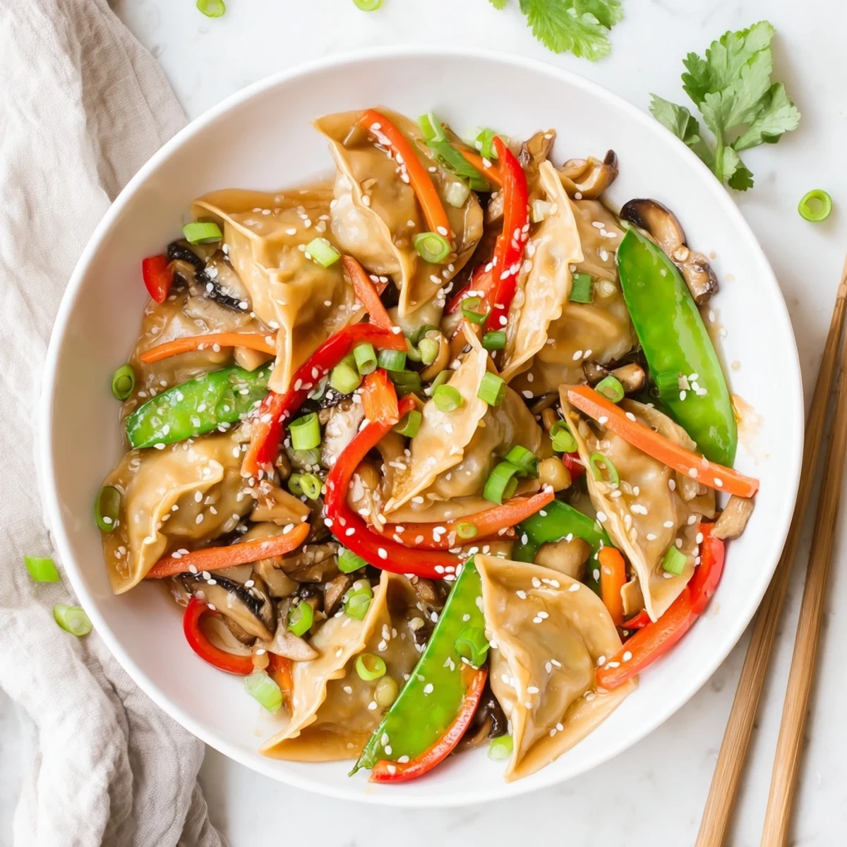 Vibrant Asian fusion potsticker stir fry served with cilantro and crunchy vegetables
