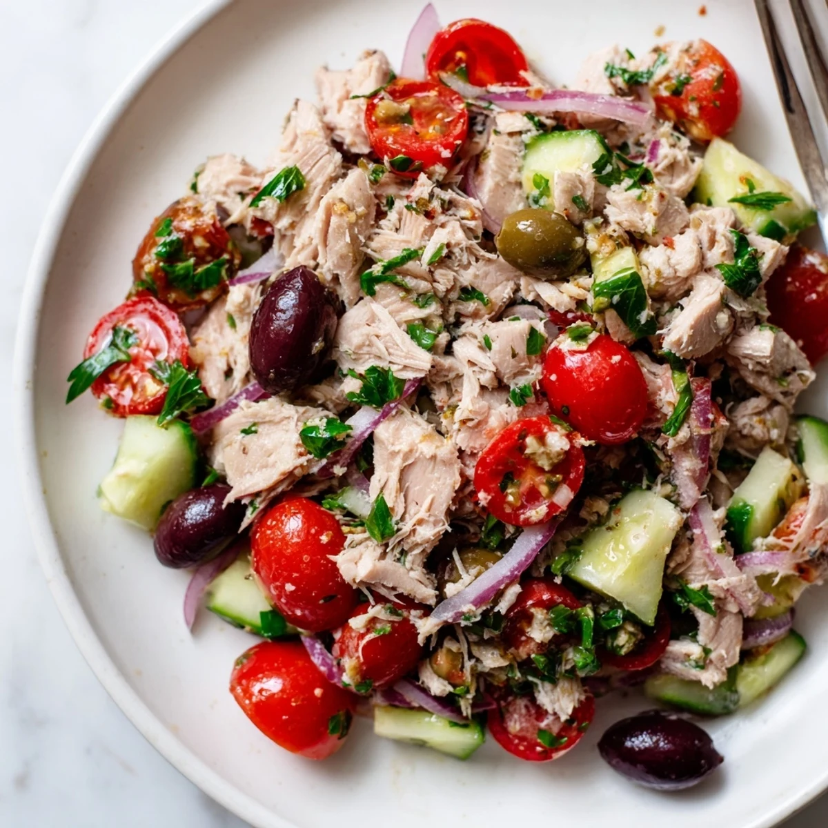 Crisp cucumber and ripe tomatoes tossed through flaked tuna Mediterranean salad