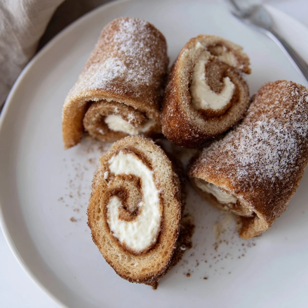 Cinnamon Roll French Toast Roll Ups served warm on brunch platter with syrup