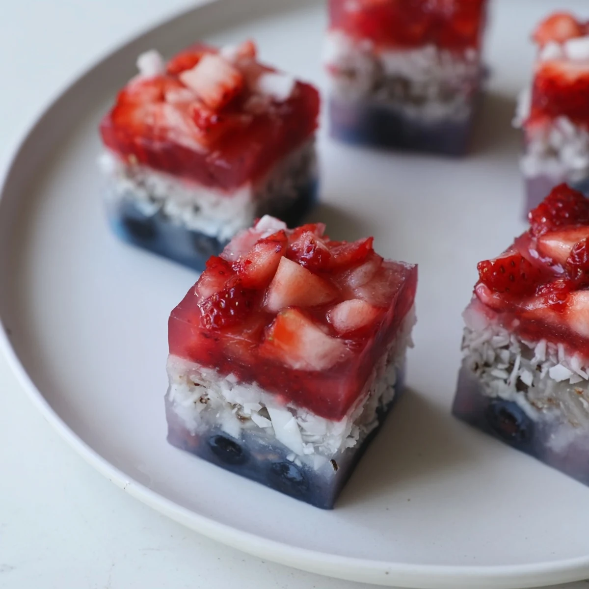 Red White And Blue Ice Cubes Recipe chilling lemonade with strawberry, blueberry, coconut layers