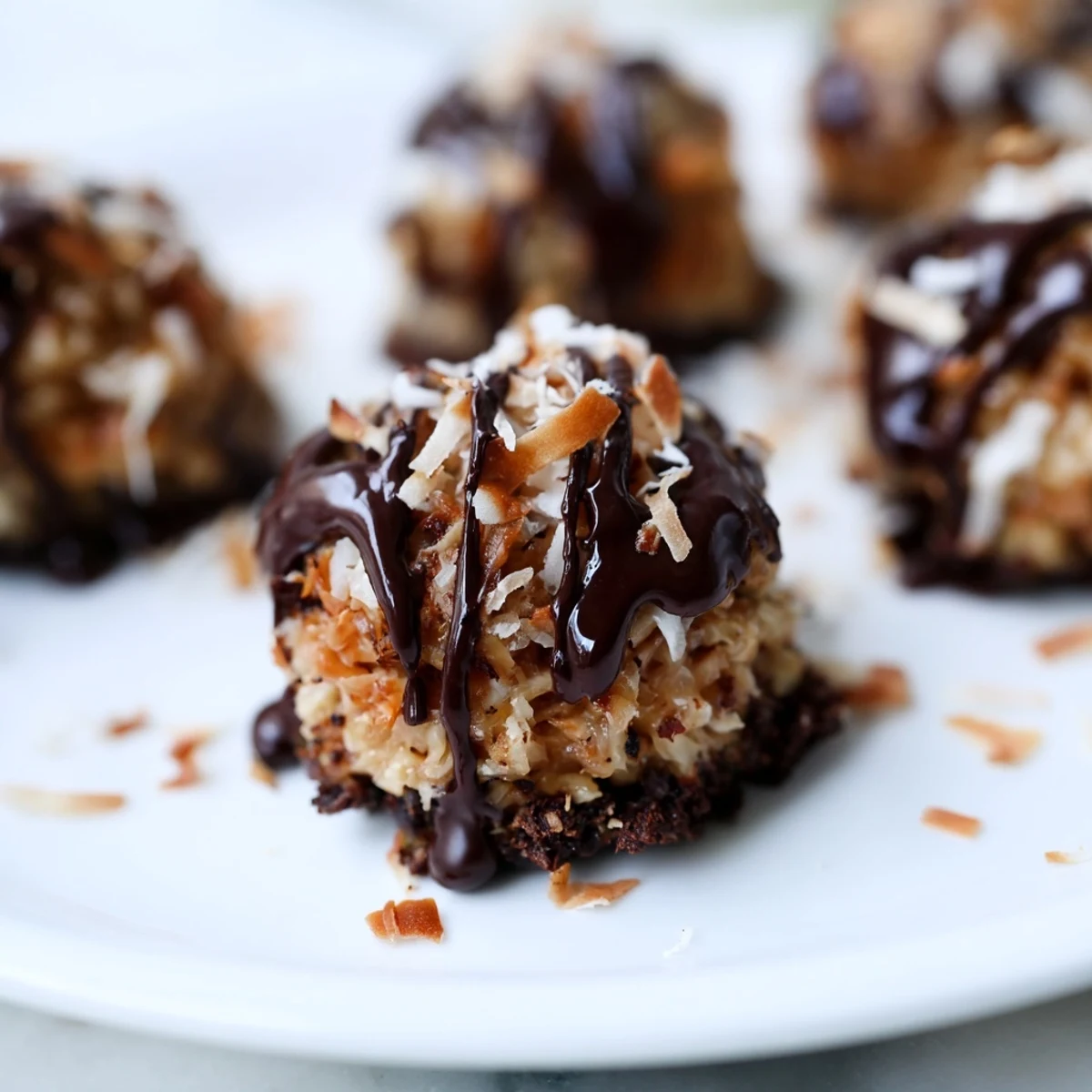 No bake Samoa bites topped with caramel coconut and drizzled dark chocolate