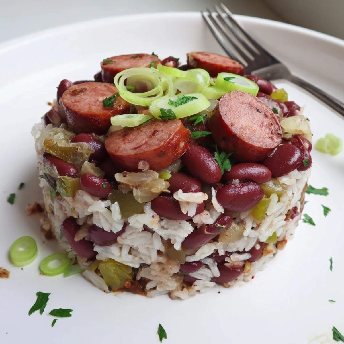 Steam rising from Red Beans and Rice, smoky sausage and parsley garnish.