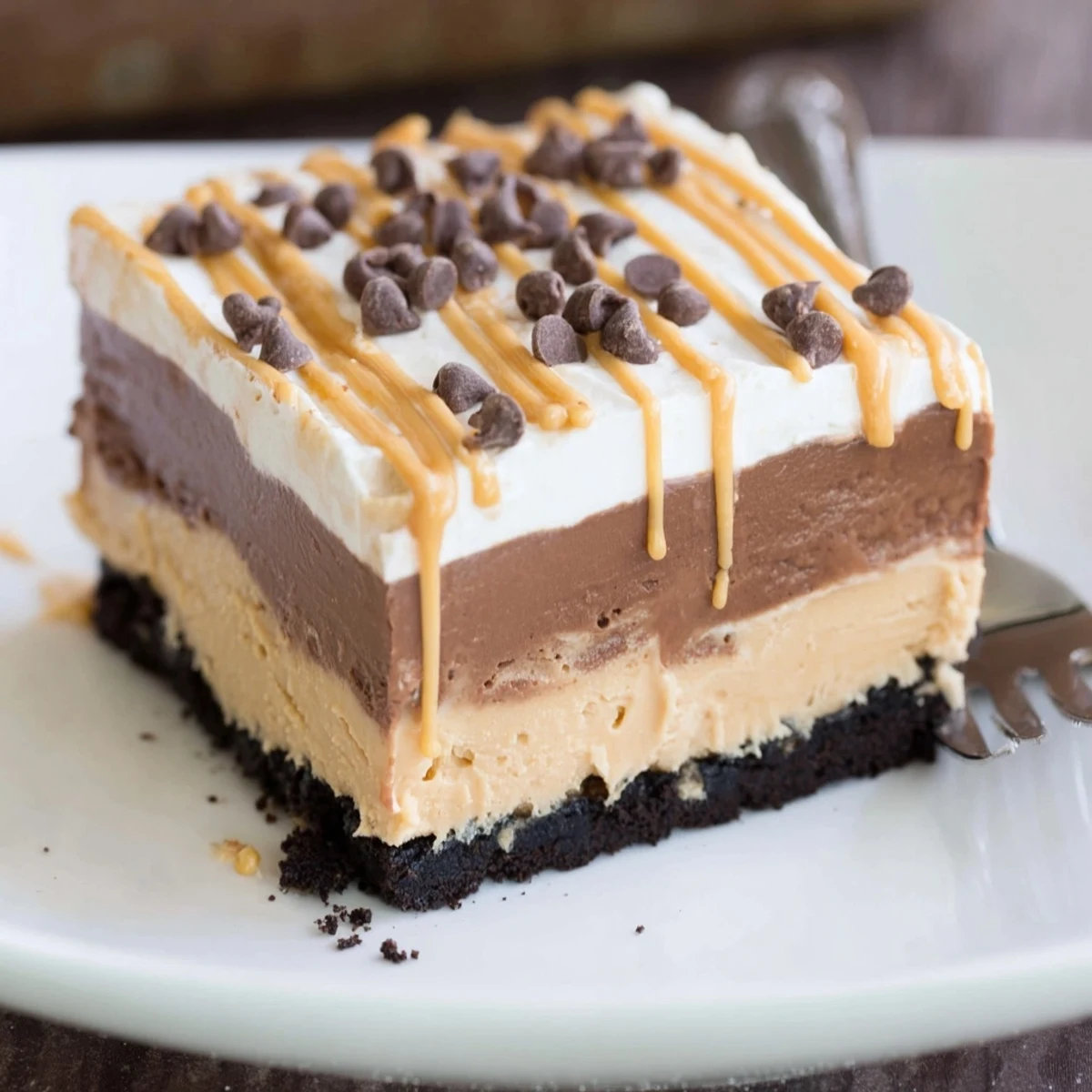 Peanut butter layered delight sliced into neat squares showing luscious creamy filling